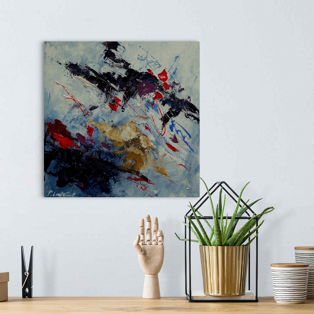 A bohemian room featuring A square abstract painting of colors of black, white and blue and hints of red in textured brush ...
