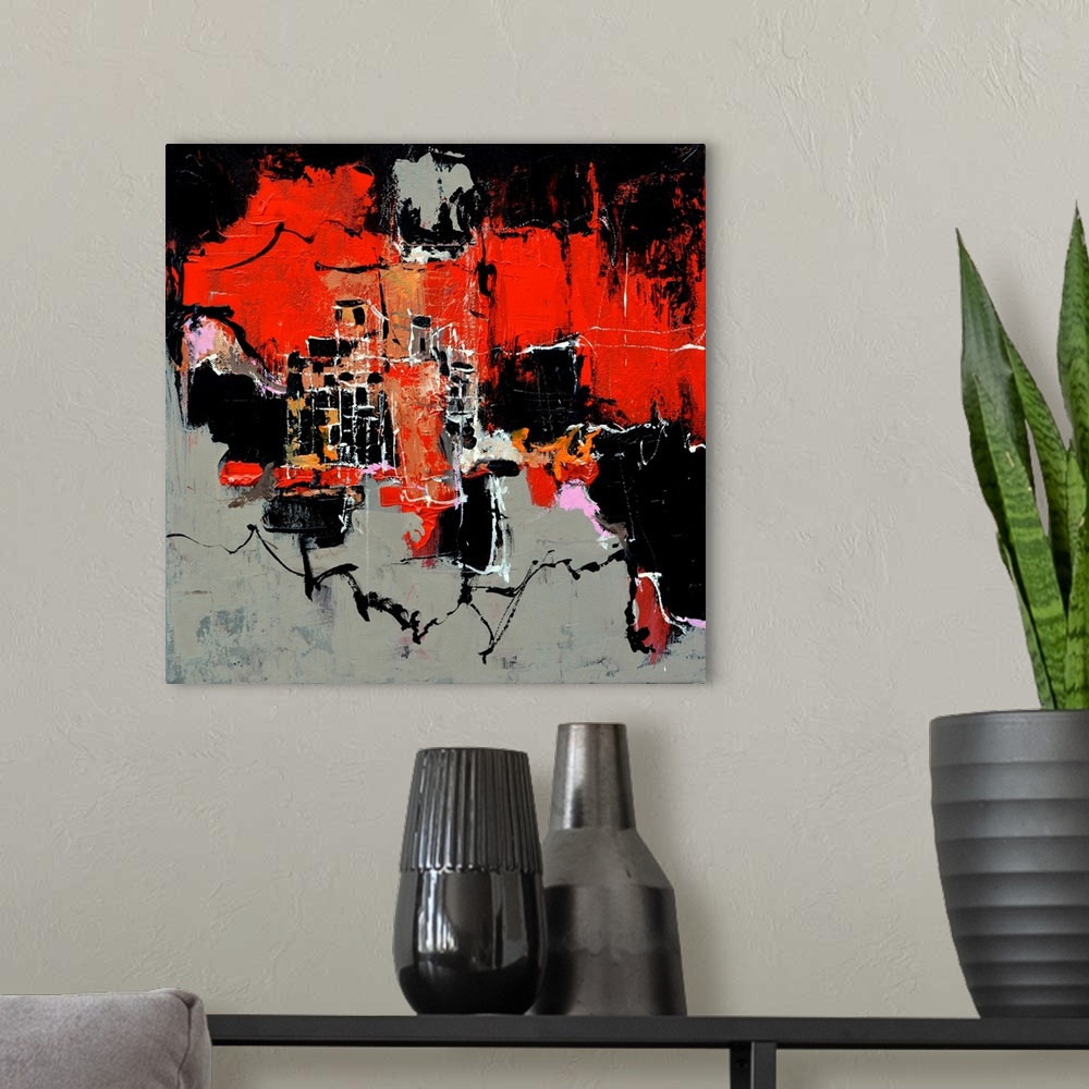 A modern room featuring A square abstract painting in shades of black, red, pink and orange with splatters of paint overl...