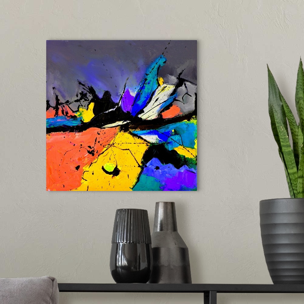 A modern room featuring A square abstract painting in vibrant shades of orange, blue, purple and yellow with splatters of...