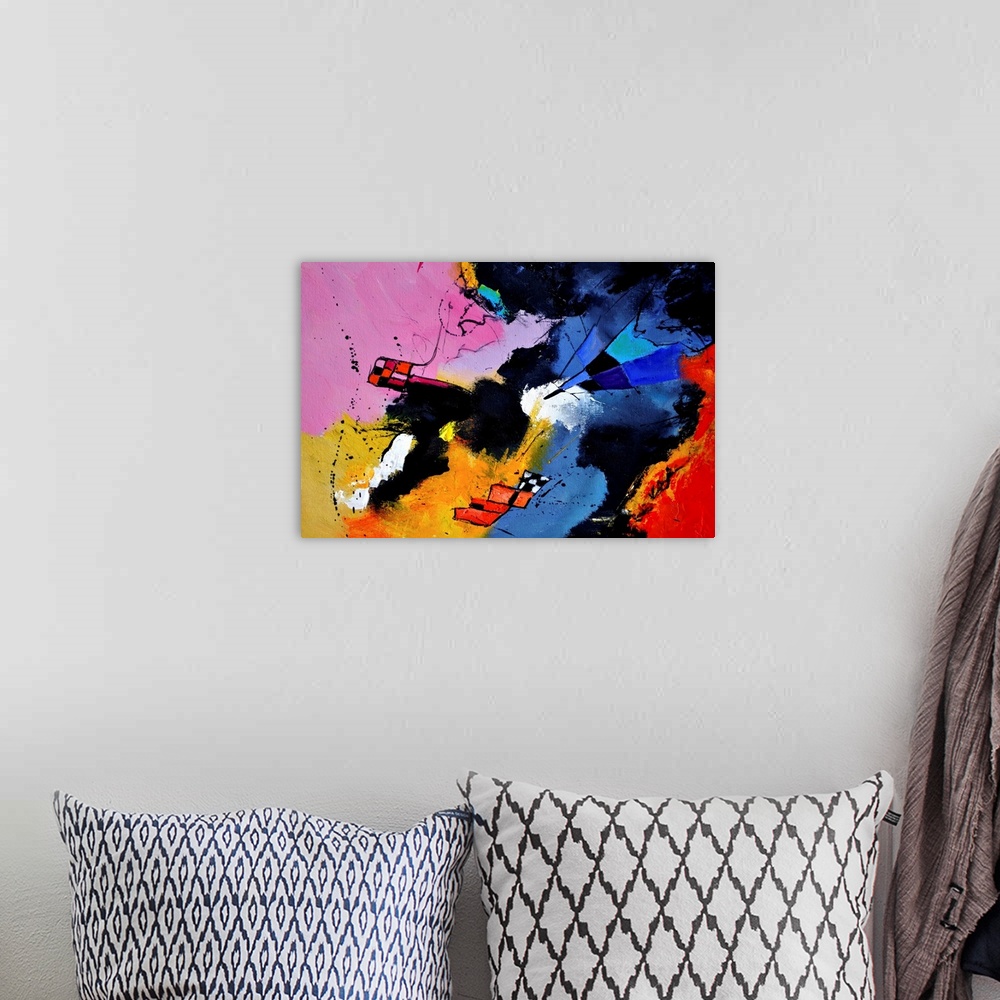 A bohemian room featuring A horizontal abstract painting in vibrant shades of blue, pink, red and yellow with splatters of ...