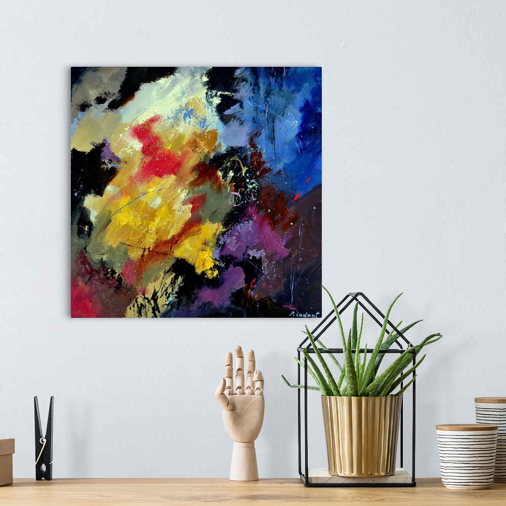 A bohemian room featuring Abstract painting with vibrant hues in shades of orange, yellow, blue, purple, and white mixed in...