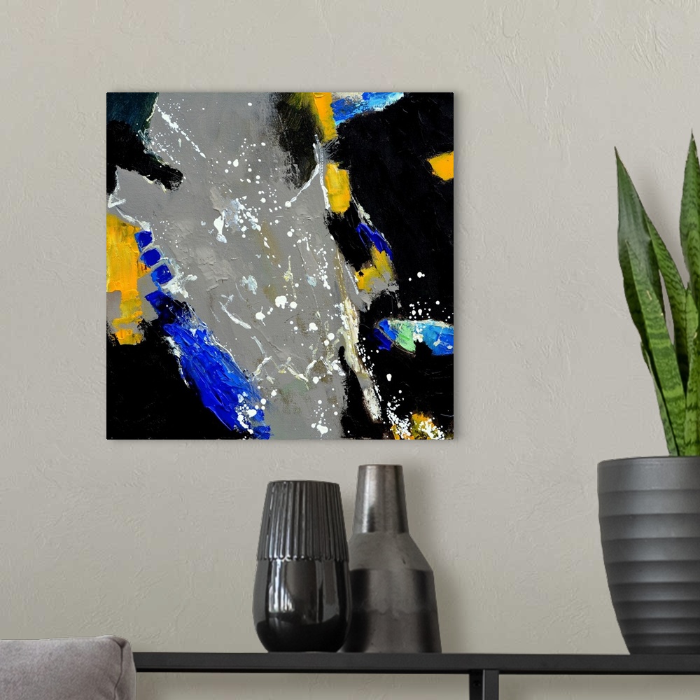 A modern room featuring A square abstract painting in textured shades of gray, blue, black and yellow with splatters of p...