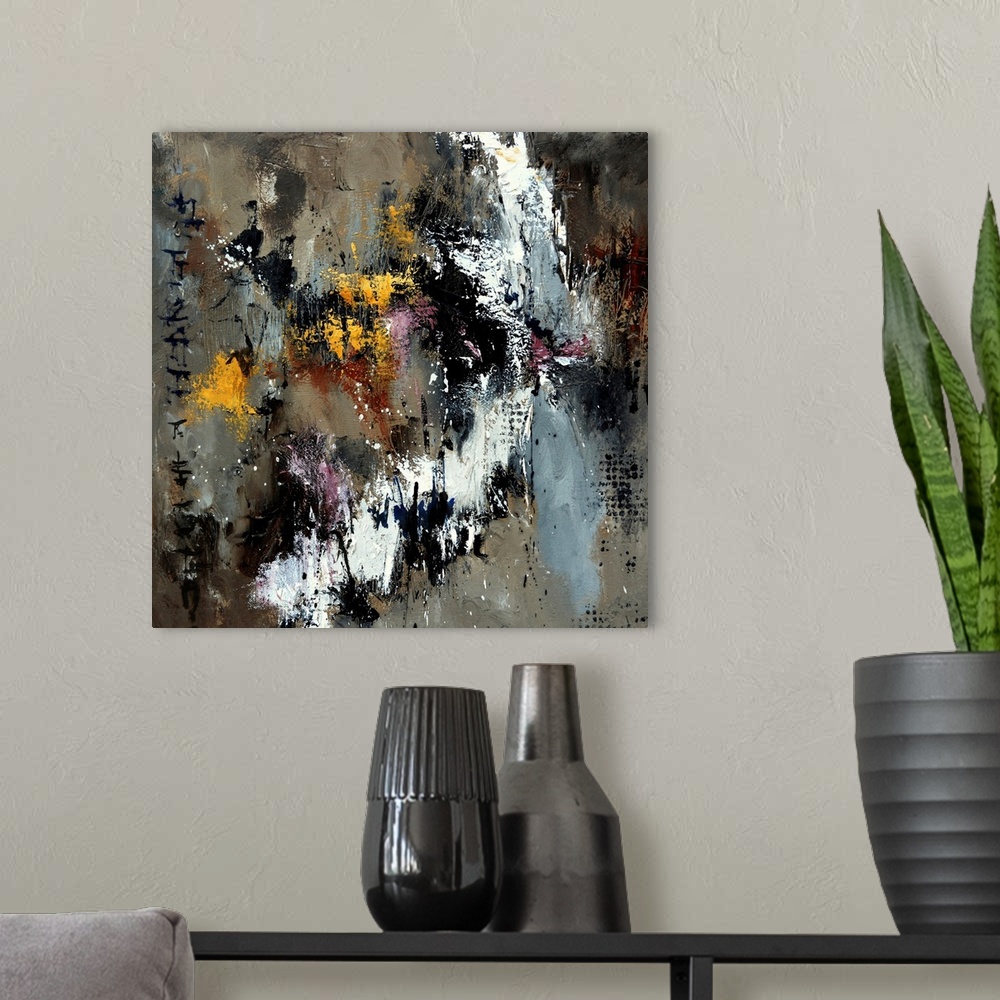 A modern room featuring A square abstract painting with shades of gray and brown with yellow accents.