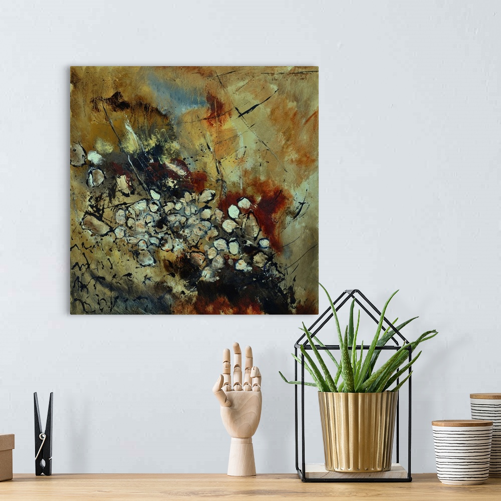 A bohemian room featuring A square abstract painting in dark shades of black, white, brown and orange with splatters of pai...