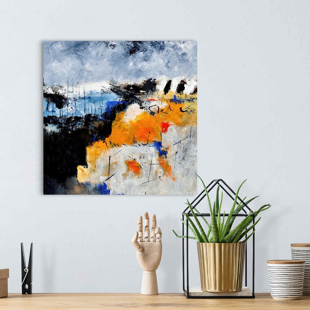A bohemian room featuring A square abstract painting in shades of black, blue, white and orange with splatters of paint ove...