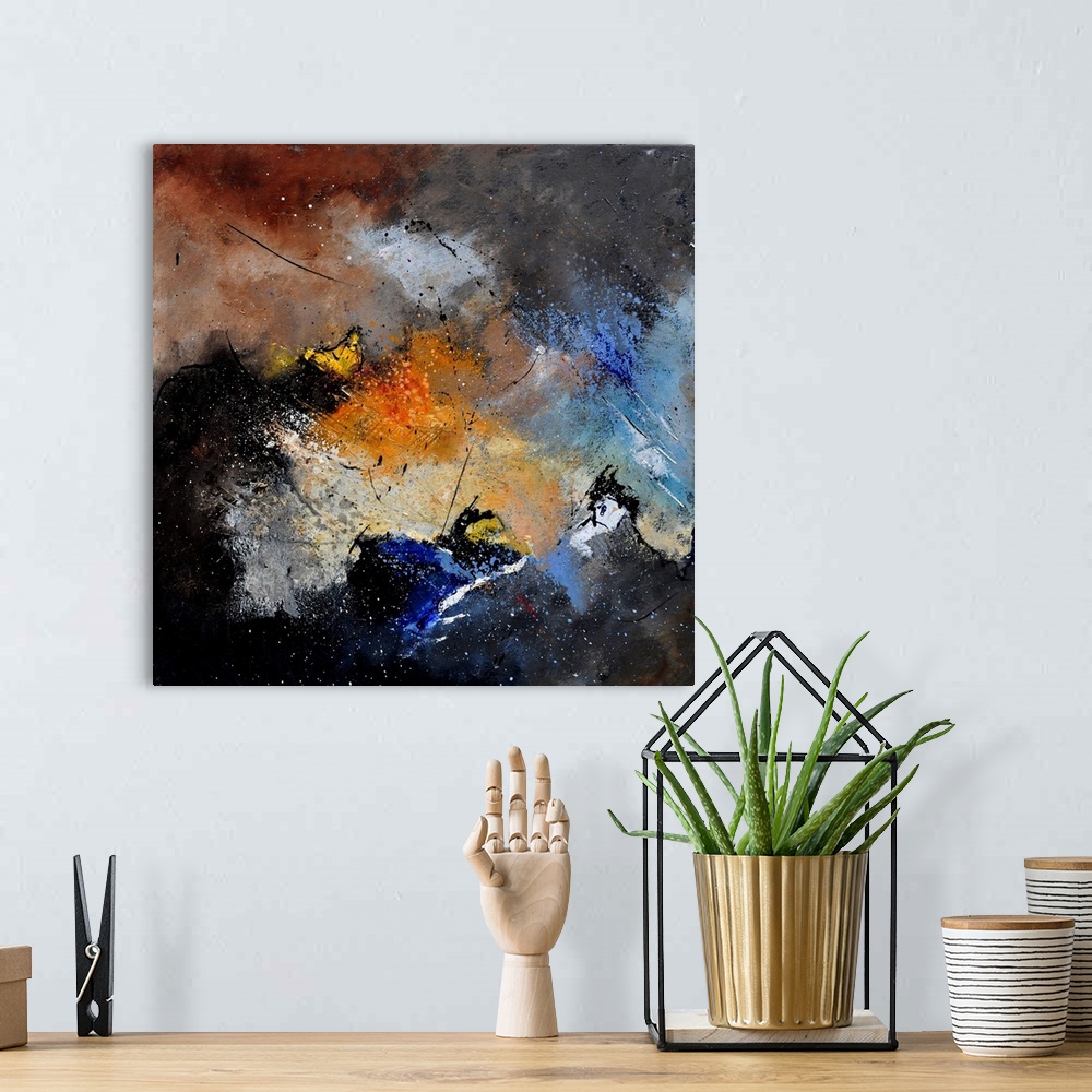 A bohemian room featuring A square abstract painting in dark shades of black, blue, brown and orange with splatters of pain...