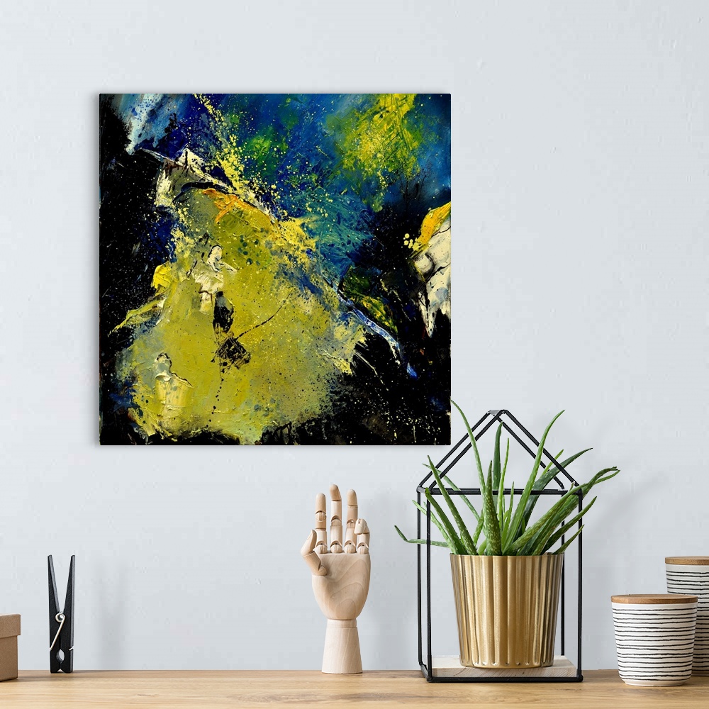 A bohemian room featuring A square abstract painting in textured shades of black, blue and yellow with splatters of paint o...