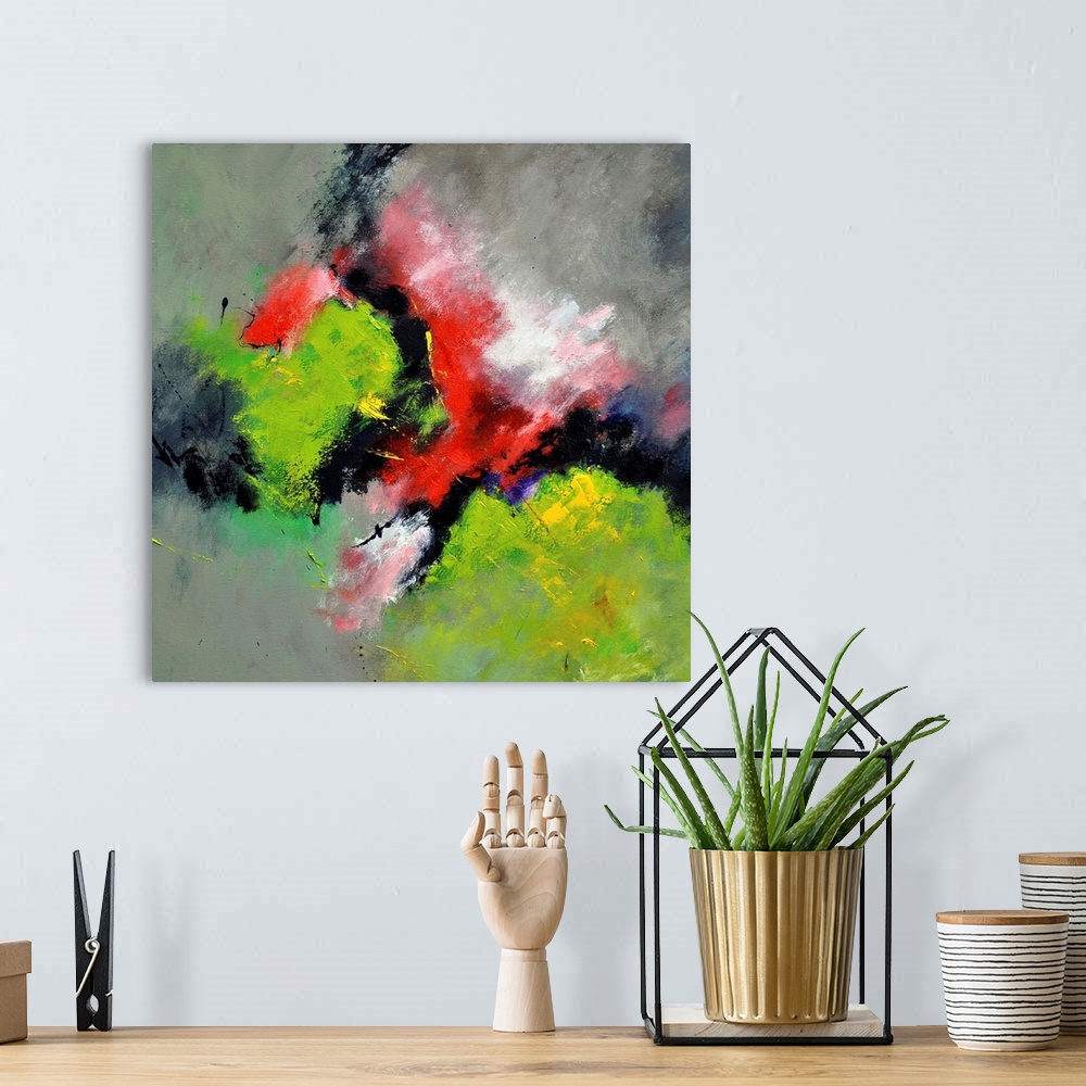 A bohemian room featuring A square abstract painting with deep textured colors of green and red.