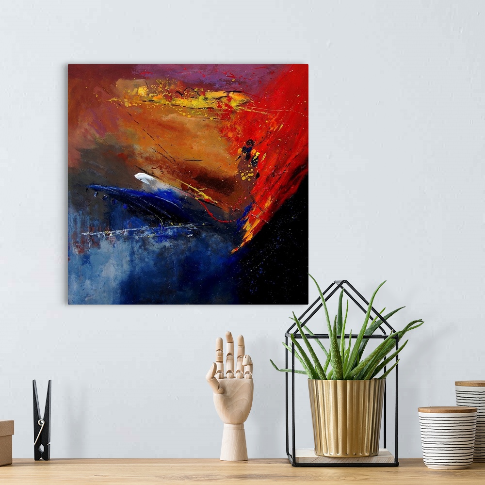 A bohemian room featuring A horizontal abstract painting of vibrant colors of yellow, red and blue in bold brush strokes an...