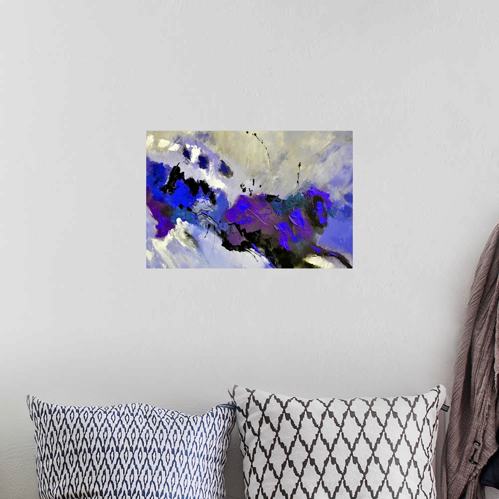 A bohemian room featuring Abstract painting in dark shades of black, blue and gray with splatters of paint overlapping.