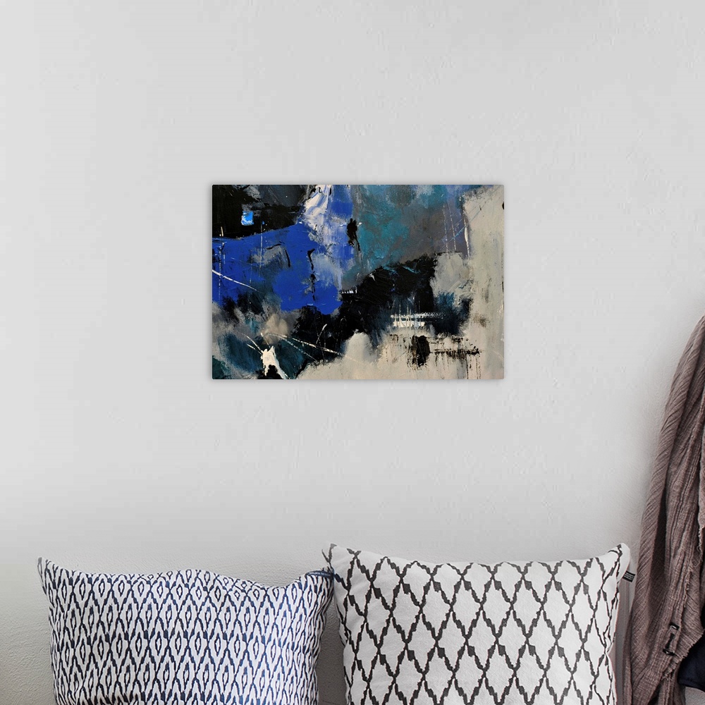 A bohemian room featuring Abstract painting in shades of  blue, gray and white mixed in with black contrasting designs.
