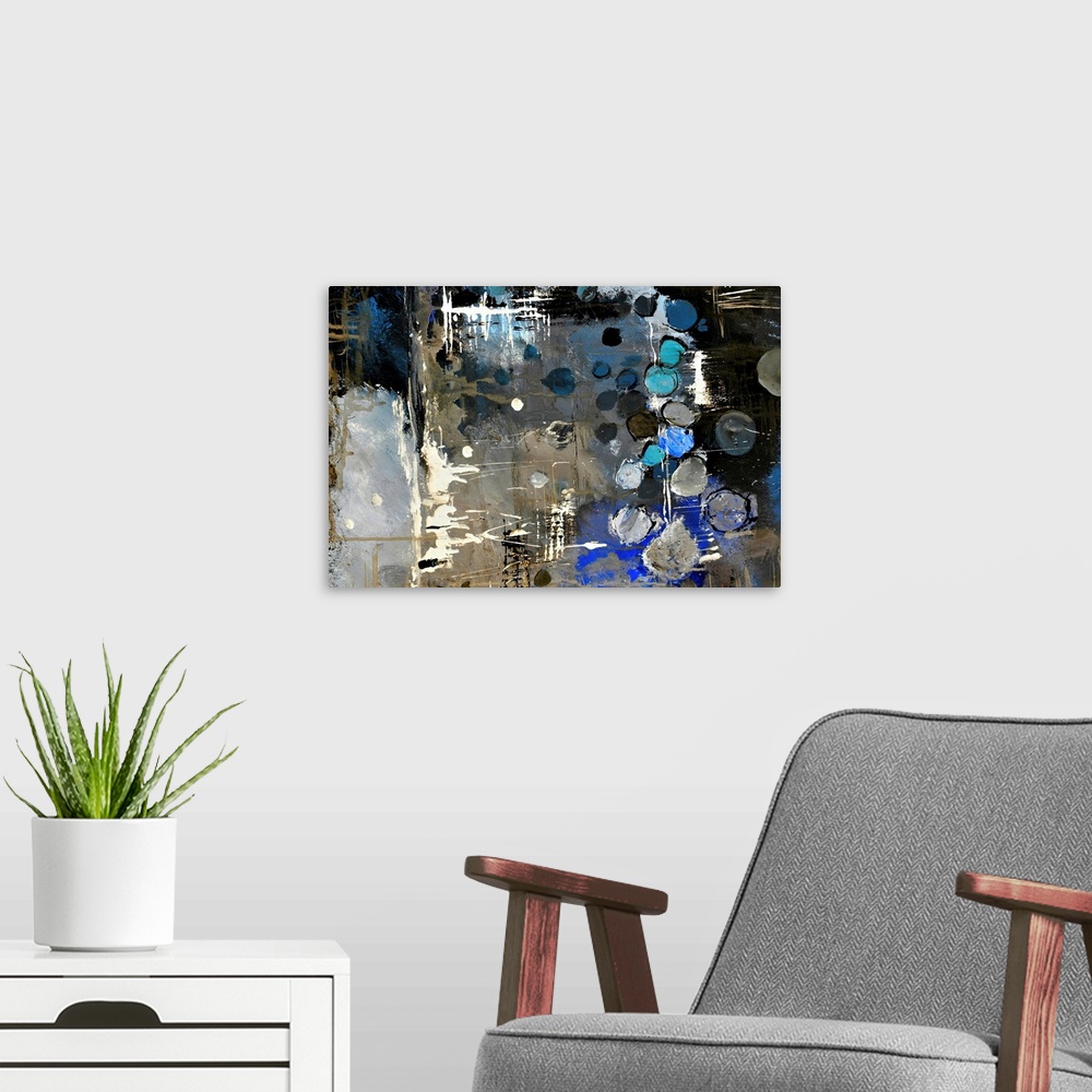 A modern room featuring Abstract painting of colors of blue, white and black in bold brush strokes and splattered paint.