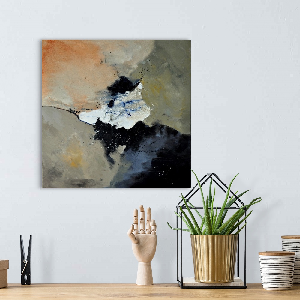 A bohemian room featuring A square abstract painting in dark colors of black, orange, white and gray with splatters of pain...
