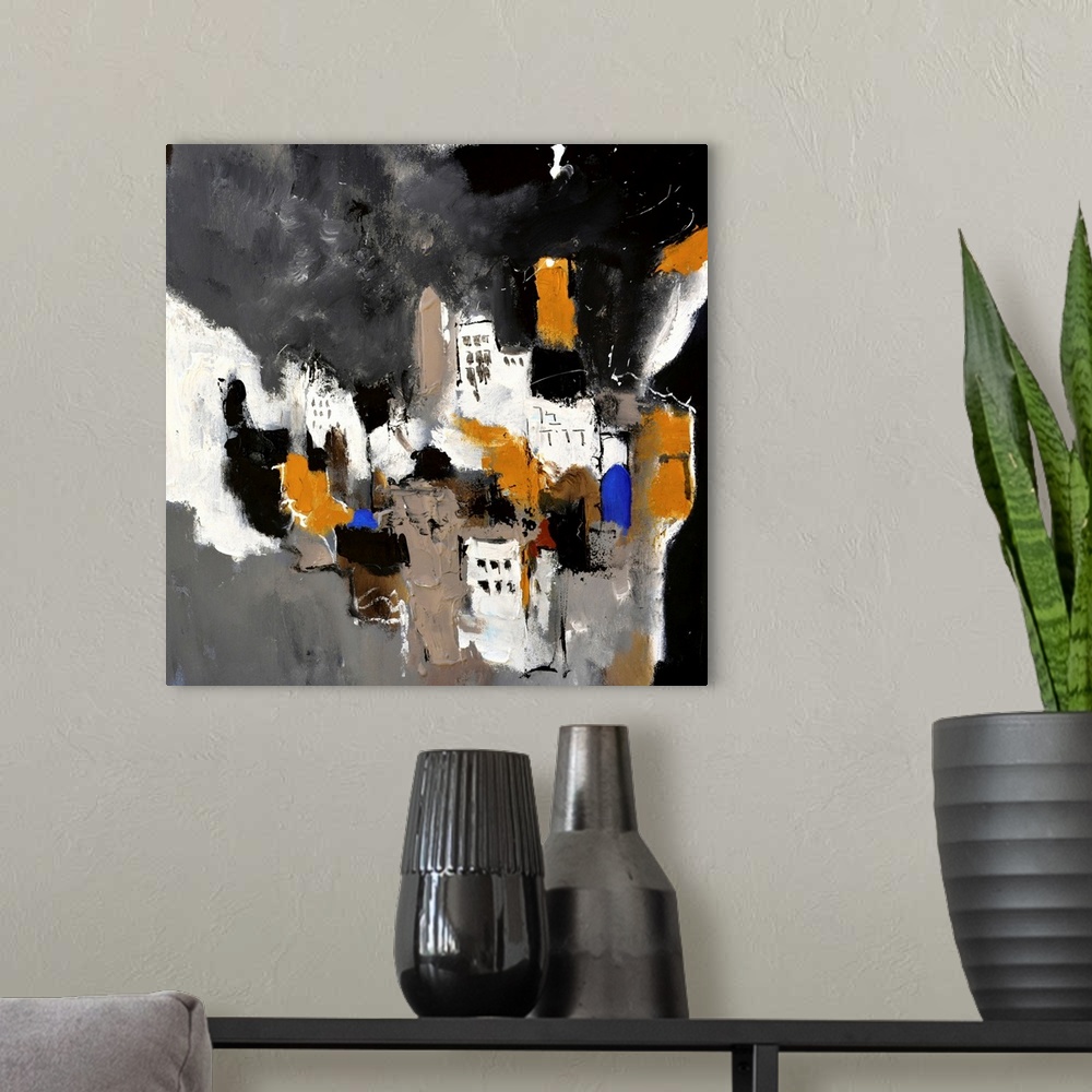 A modern room featuring A square abstract painting in textured shades of black, brown, white and blue with splatters of p...