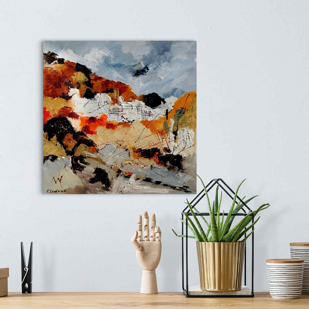 A bohemian room featuring A vertical abstract painting with muted colors of gray, brown and orange.