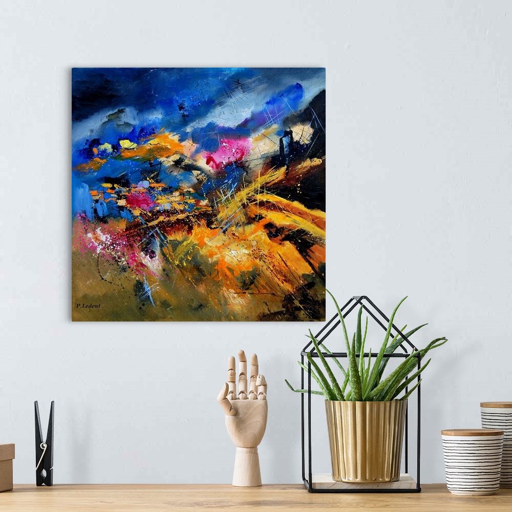 A bohemian room featuring An abstract landscape painting of a hilly countryside with colorful flowers in a field.