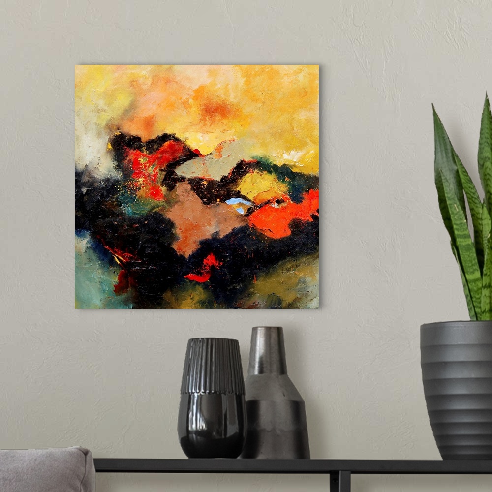 A modern room featuring A square abstract landscape with vivid colors of yellow and orange.