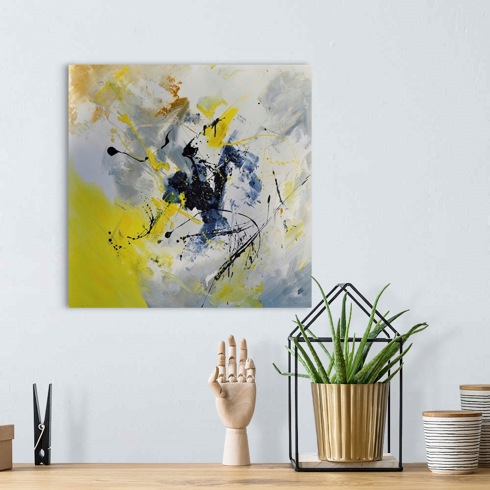 A bohemian room featuring Abstract painting in shades of yellow, blue, gray and white mixed in with black contrasting designs.