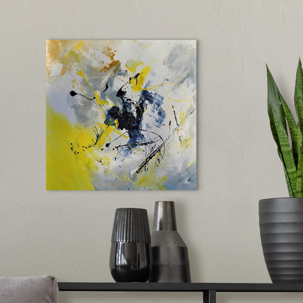 A modern room featuring Abstract painting in shades of yellow, blue, gray and white mixed in with black contrasting designs.