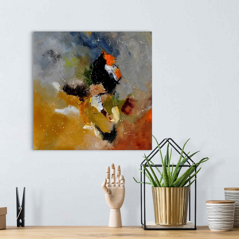 A bohemian room featuring Abstract painting in shades of orange, yellow, gray and white mixed in with black contrasting des...