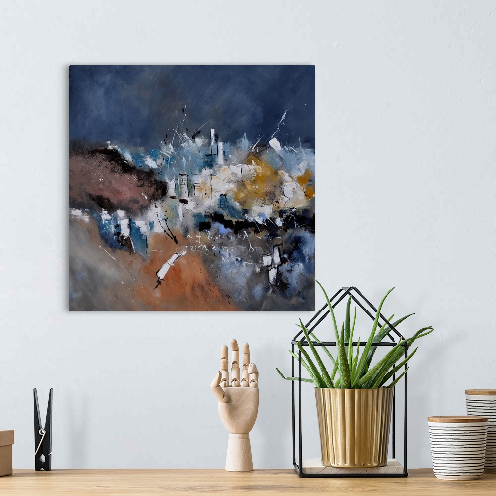 A bohemian room featuring A square abstract painting in dark shades of black, blue, white and orange with splatters of pain...