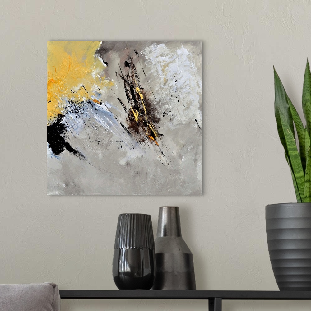 A modern room featuring Abstract painting in shades of black, gray, white and yellow with splatters of paint overlapping.