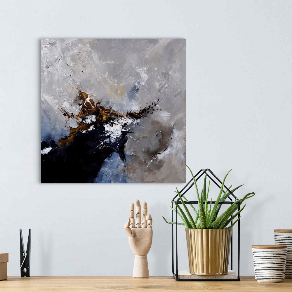 A bohemian room featuring A square abstract painting in dark shades of black, brown, white and gray with splatters of paint...