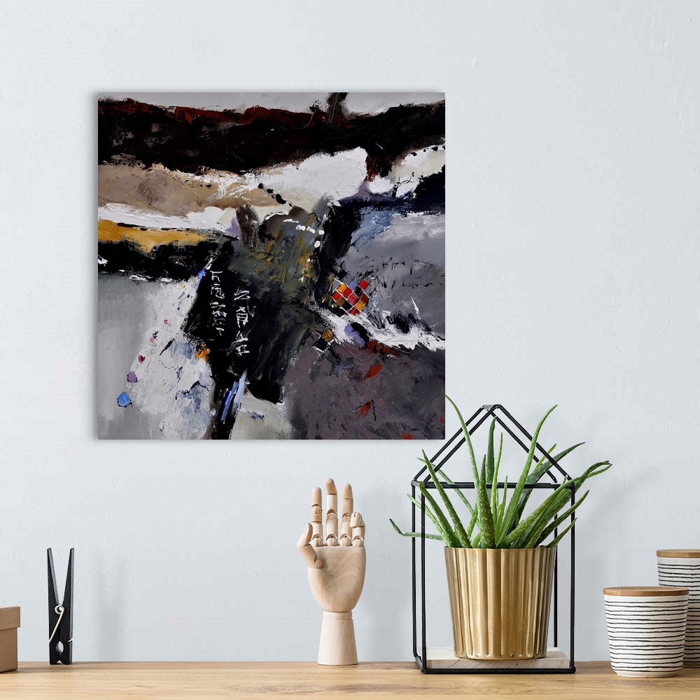 A bohemian room featuring A square abstract painting in dark shades of black, blue, white and brown with splatters of paint...