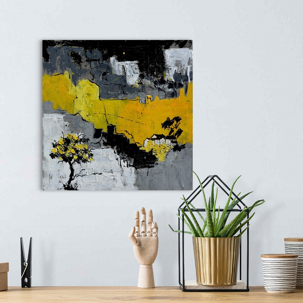 A bohemian room featuring A square abstract painting in textured shades of black, gray and yellow with splatters of paint o...
