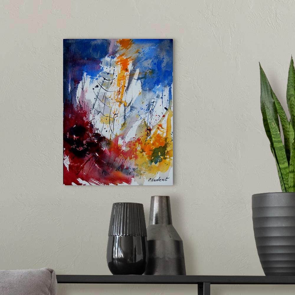 A modern room featuring A vertical abstract painting with deep colors of blue, red and yellow.