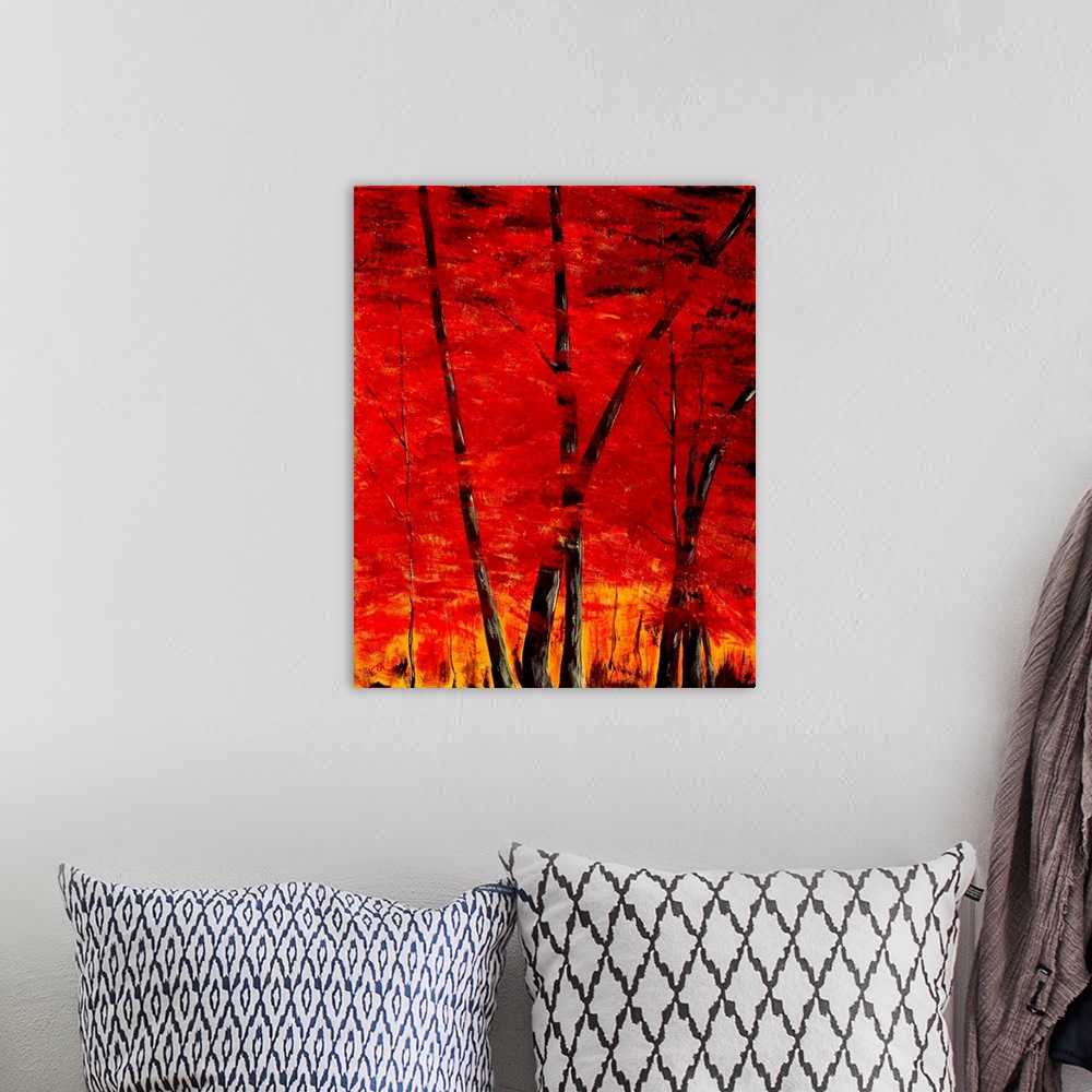 A bohemian room featuring A intense contemporary painting of trees in a forest, with leaves of red and yellow.
