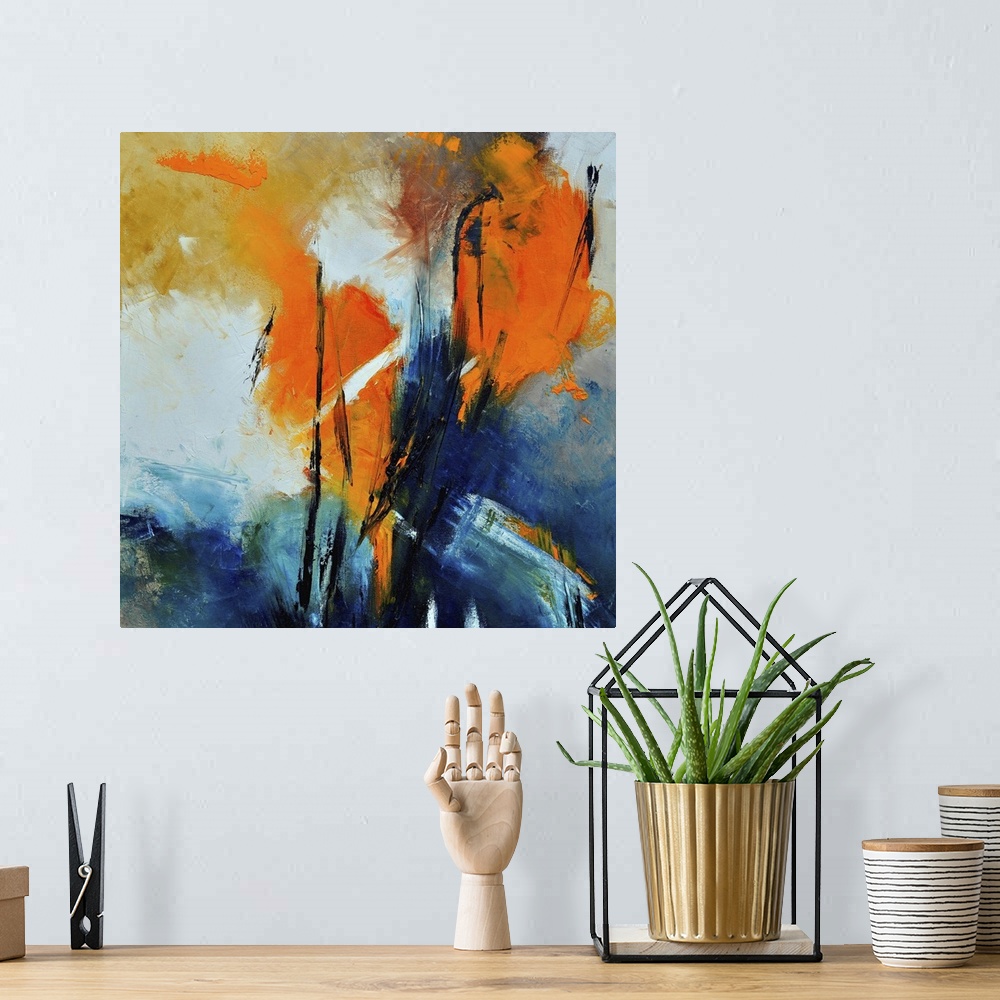 A bohemian room featuring A square abstract painting with deep textured colors of orange and blue.