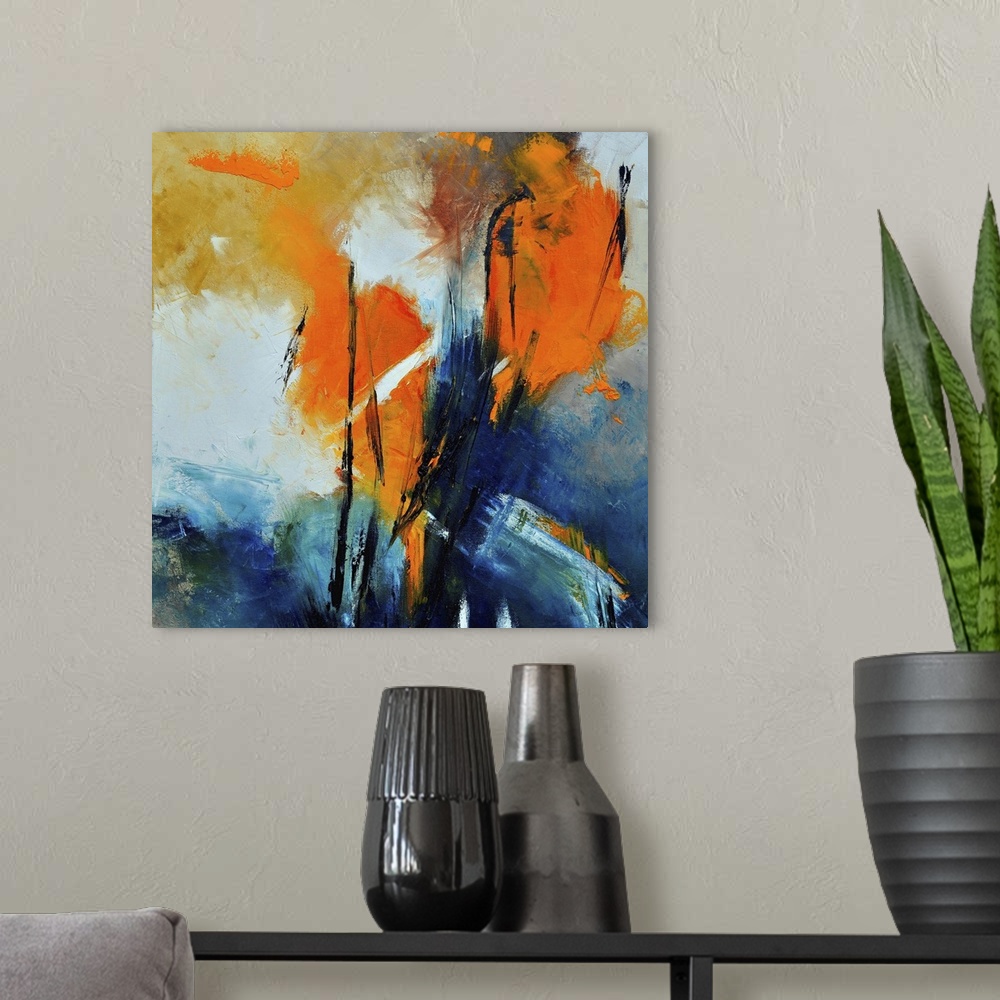 A modern room featuring A square abstract painting with deep textured colors of orange and blue.