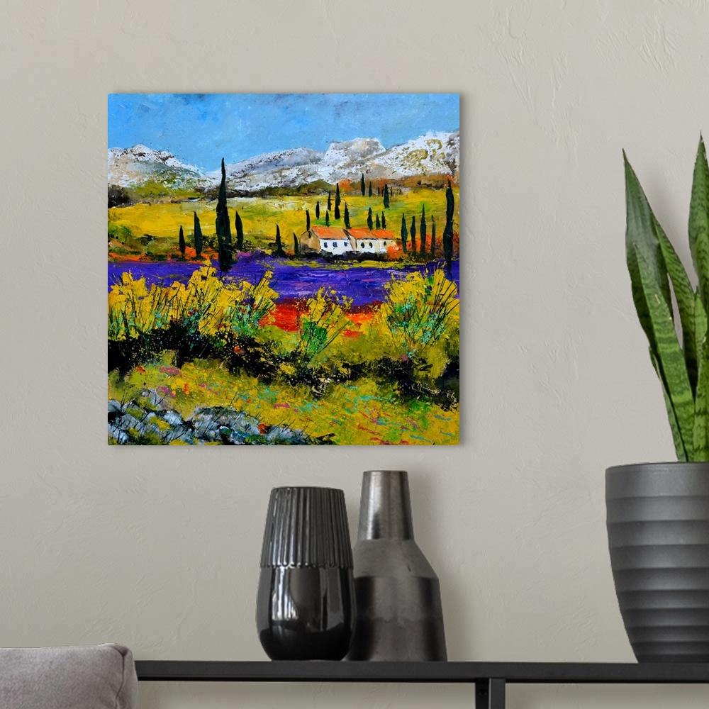 A modern room featuring Vibrant painting of a bright Summer day with a house next to a river and mountains in the distance.
