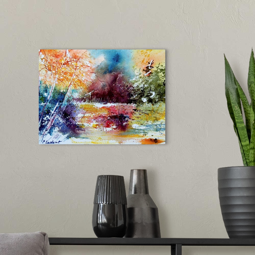 A modern room featuring A horizontal abstract landscape of a forest with watercolors of orange, red and blue.
