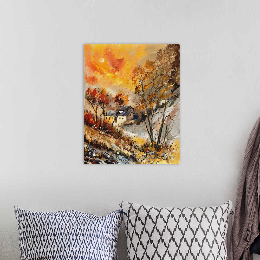A bohemian room featuring Vertical painting of bare trees in a field of golden grass with a vibrant golden sky on an autumn...