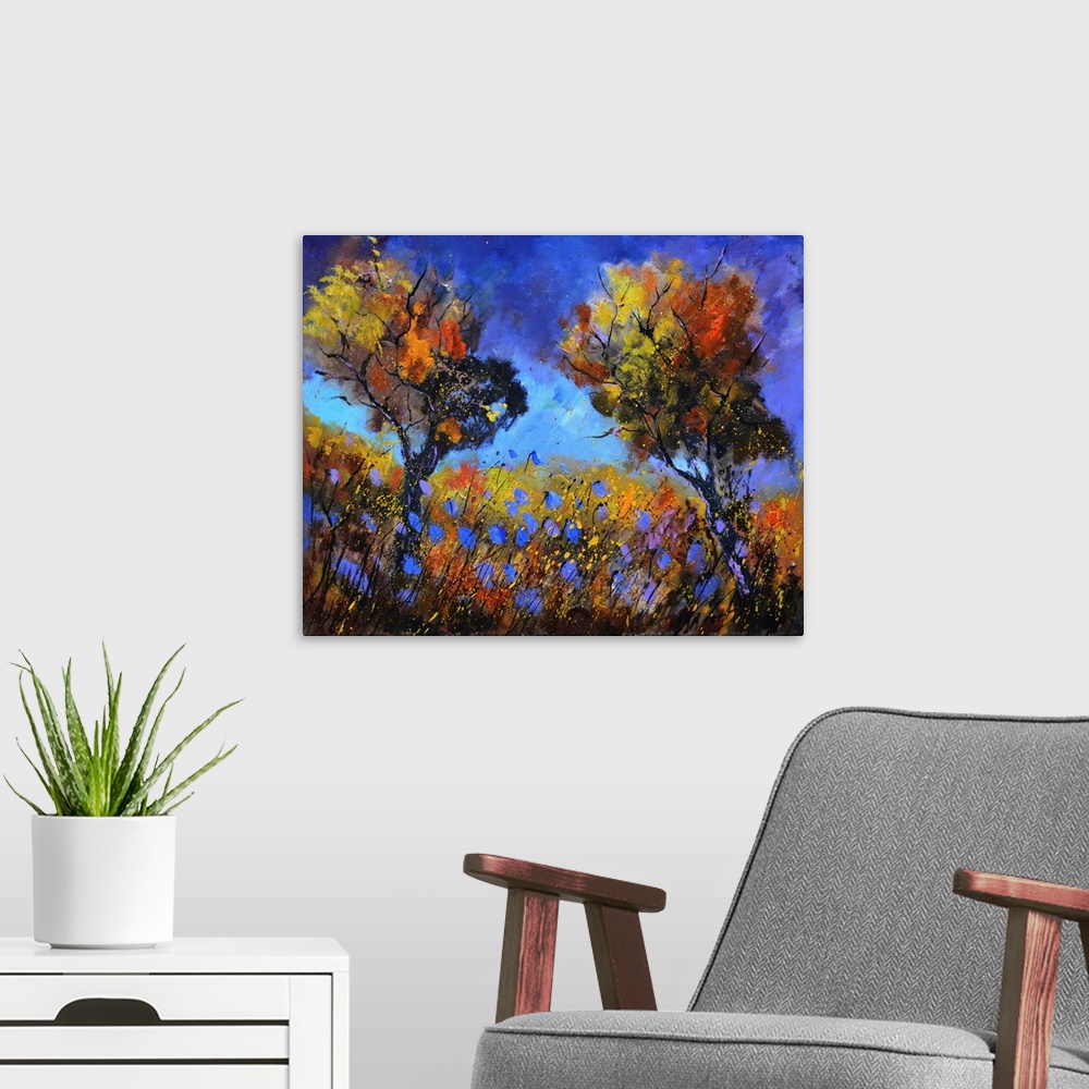 A modern room featuring Contemporary abstract landscape painting in vibrant hues.