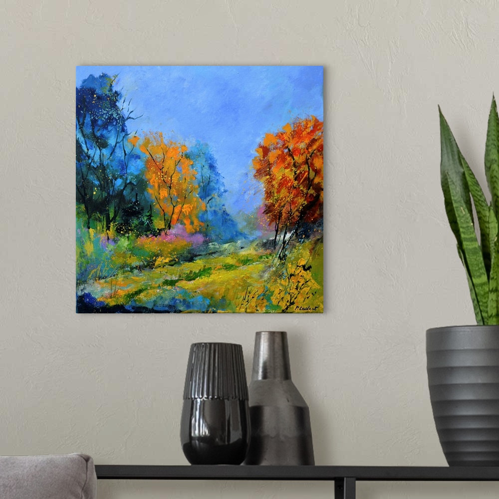 A modern room featuring Contemporary abstract landscape painting in vibrant hues.