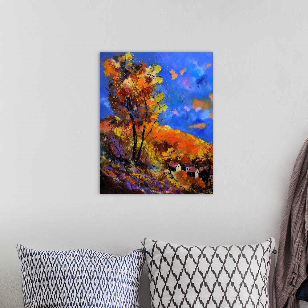 A bohemian room featuring Vibrant painting of an autumn day with blossoming trees, a colorful sky, and a village in the dis...