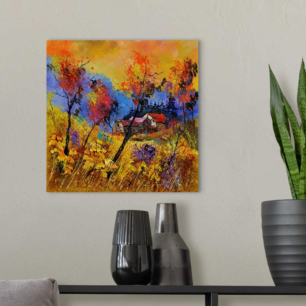 A modern room featuring Vibrant painting of a fall day with golden trees, a colorful sky, and a house in the distance.