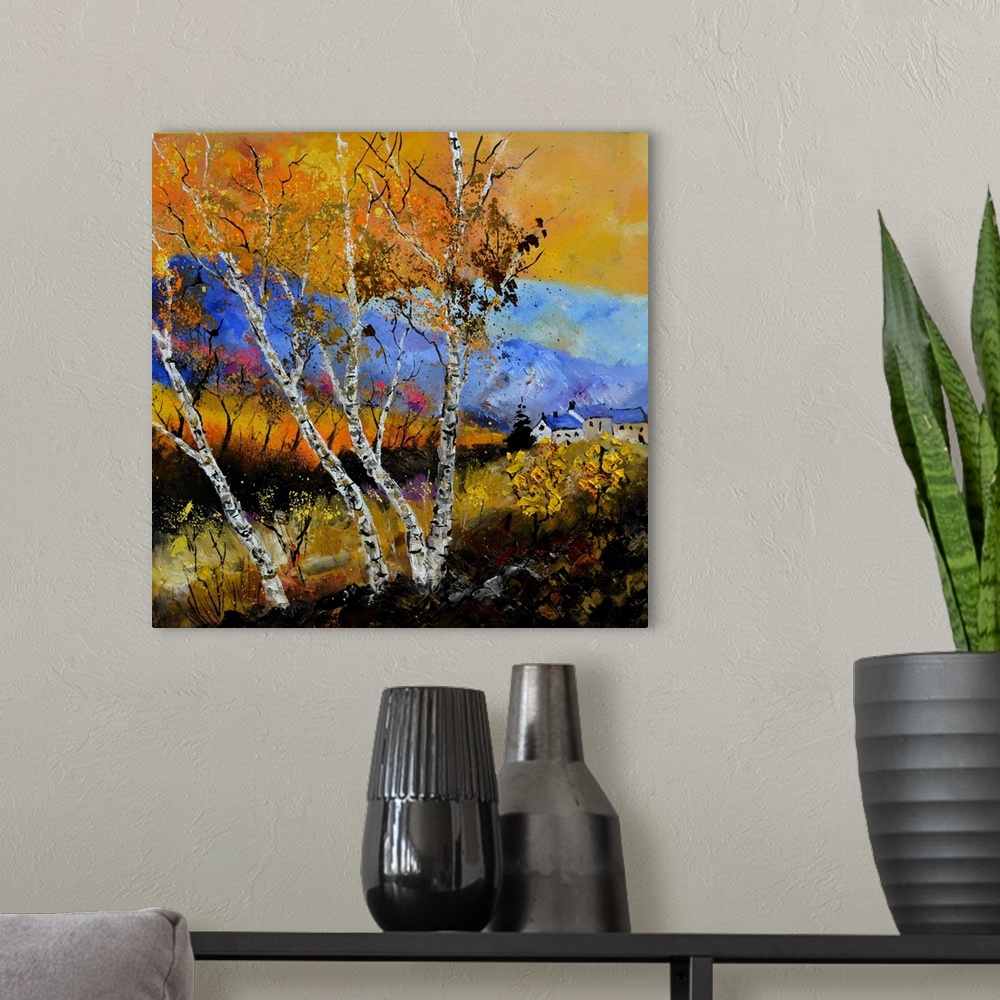 A modern room featuring Square painting of an Autumn landscape with orange and yellow leaves on trees in the foreground a...