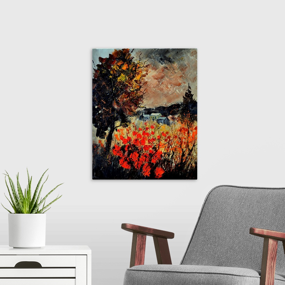 A modern room featuring An autumn scene of red blooming flowers in a field near a small village.