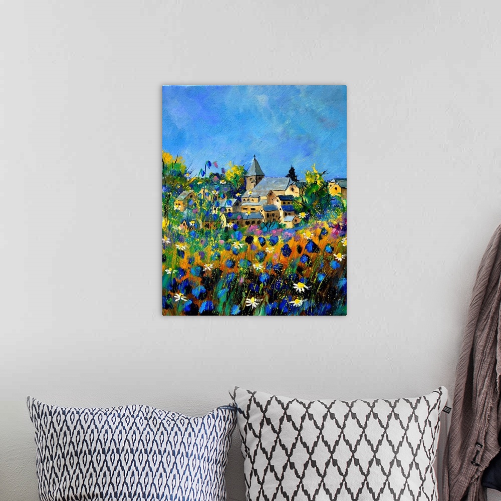 A bohemian room featuring Vertical painting of a field of colorful flowers in the foreground and a Belgium village in the b...