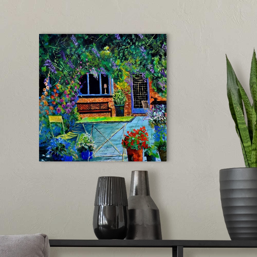 A modern room featuring Square painting of a patio surrounded by blooming flowers in a garden.