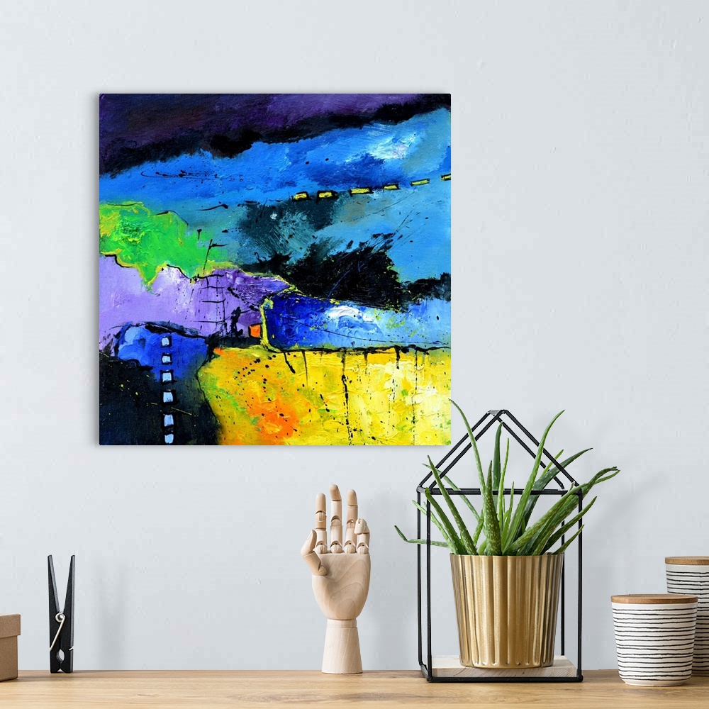 A bohemian room featuring A square abstract painting in vibrant shades of green, purple, blue and yellow with splatters of ...