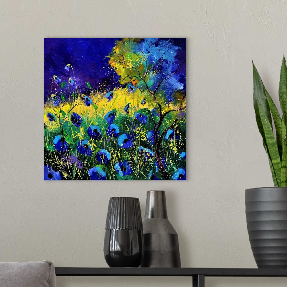 A modern room featuring Vibrant painting of blue poppies in a filed with a dark sky.