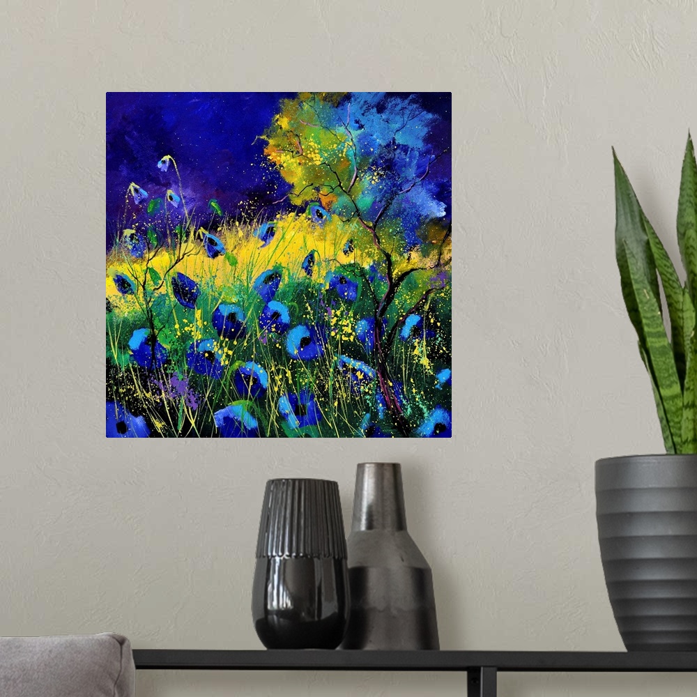 A modern room featuring Vibrant painting of blue poppies in a filed with a dark sky.