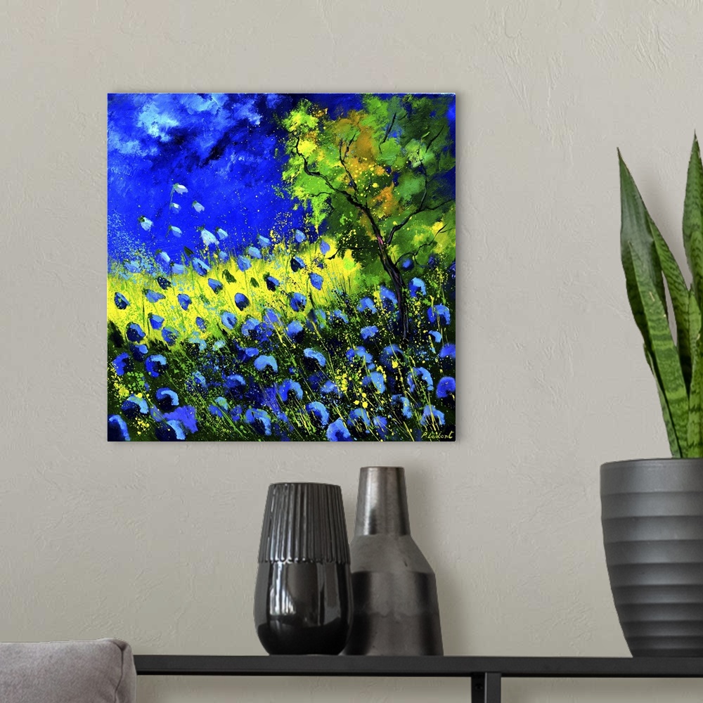 A modern room featuring Square painting of blue poppies in a field and a bright blue sky with small speckles of paint ove...
