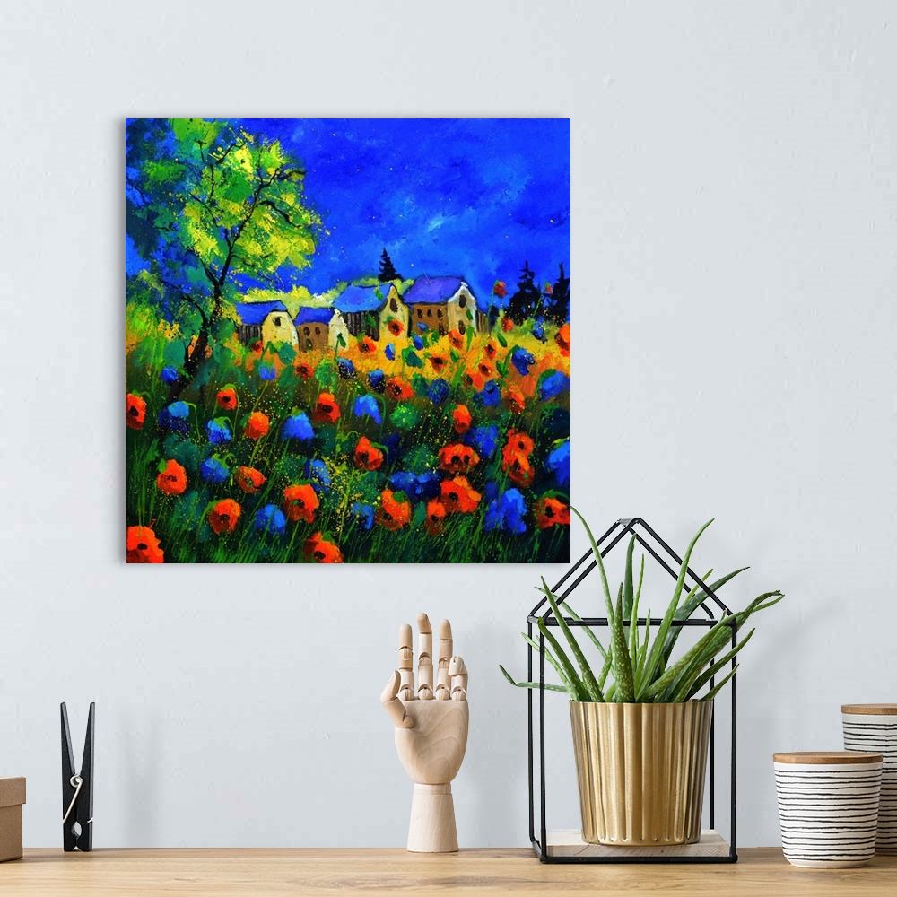 A bohemian room featuring Vibrant painting of a bright Summer day with blossoming poppies, a colorful sky, and a village in...