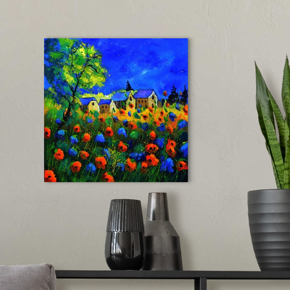A modern room featuring Vibrant painting of a bright Summer day with blossoming poppies, a colorful sky, and a village in...